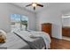 Bedroom with natural light, wood flooring and dresser at 150 Dean Dr, Tyrone, GA 30290