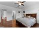 Bedroom with hardwood floors, a ceiling fan, and modern furnishings at 150 Dean Dr, Tyrone, GA 30290