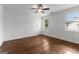 Bedroom with hardwood flooring, ceiling fan, and bright natural light from a window at 150 Dean Dr, Tyrone, GA 30290