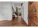 Inviting home foyer featuring hardwood floors, a staircase, and views of the living room and other interior spaces at 150 Dean Dr, Tyrone, GA 30290