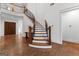 Beautiful foyer with hardwood floors, curved staircase, and an elegant design at 150 Dean Dr, Tyrone, GA 30290