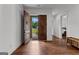 Stunning front entrance with wooden doors and sleek hardwood flooring, with a view into the home at 150 Dean Dr, Tyrone, GA 30290