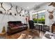 Well-lit home office with hardwood floors, built-in desk, and views of the backyard at 150 Dean Dr, Tyrone, GA 30290