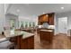 This kitchen features an island, granite countertops and hardwood flooring at 150 Dean Dr, Tyrone, GA 30290