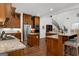 Gourmet kitchen showcases wood cabinets, stainless steel appliances, and granite countertops at 150 Dean Dr, Tyrone, GA 30290