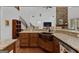 Kitchen island with granite counter and copper sink, complementing the open-concept living space and staircase at 150 Dean Dr, Tyrone, GA 30290