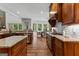 Open-concept kitchen with stainless appliances and a view of the dining room at 150 Dean Dr, Tyrone, GA 30290