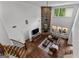 The living room has a stone fireplace and large windows to let in natural light at 150 Dean Dr, Tyrone, GA 30290