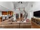 Open living room featuring hardwood floors, staircase and modern kitchen at 150 Dean Dr, Tyrone, GA 30290