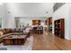 Open living room with hardwood floors, flowing into the kitchen with modern appliances at 150 Dean Dr, Tyrone, GA 30290