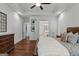 Comfortable main bedroom with tray ceiling, providing access to a walk-in closet and ensuite bathroom at 150 Dean Dr, Tyrone, GA 30290