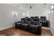 Home theater boasts reclining seats and sconce lighting at 150 Dean Dr, Tyrone, GA 30290