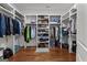 Spacious walk-in closet with custom shelving and hardwood flooring at 150 Dean Dr, Tyrone, GA 30290