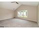 Spacious bedroom featuring neutral tones, plush carpeting, ceiling fan, and a window with an exterior view at 2801 Priestcliff Dr, Smyrna, GA 30080