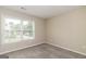 Bedroom with neutral paint, carpet, a window view to the exterior, and electrical outlets at 2801 Priestcliff Dr, Smyrna, GA 30080