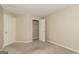 Bedroom features neutral paint, carpet, white doors, and a closet with a view to the exterior at 2801 Priestcliff Dr, Smyrna, GA 30080