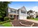 Charming two-story home featuring an attached two-car garage and beautifully landscaped front yard at 2801 Priestcliff Dr, Smyrna, GA 30080
