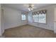 Bedroom features a ceiling fan, carpet, and window with valance for comfort and style at 668 Spring Place Ne Rd, White, GA 30184