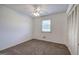 Bedroom featuring carpet, a window, a closet, and a ceiling fan at 668 Spring Place Ne Rd, White, GA 30184