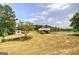 Charming single-story home with a covered carport, surrounded by a well-maintained lawn and mature trees at 668 Spring Place Ne Rd, White, GA 30184