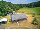 Lovely home with a gray roof and a charming porch and wooden deck overlooking the spacious green yard at 668 Spring Place Ne Rd, White, GA 30184