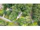 Aerial view features the property nestled among mature trees, highlighting privacy and natural beauty at 2179 Mountclaire Ct, Stone Mountain, GA 30087
