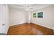 Bedroom with hardwood floors, neutral walls, and a window providing natural light at 2179 Mountclaire Ct, Stone Mountain, GA 30087