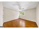 Bedroom with hardwood floors, a ceiling fan, and a window at 2179 Mountclaire Ct, Stone Mountain, GA 30087