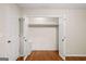 A closet with double doors and a shelf and rod for storage at 2179 Mountclaire Ct, Stone Mountain, GA 30087