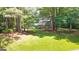 An exterior view of a traditional home nestled in a lush, wooded lot at 2179 Mountclaire Ct, Stone Mountain, GA 30087