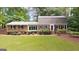 Charming brick home with manicured lawn and mature trees offering great curb appeal at 2179 Mountclaire Ct, Stone Mountain, GA 30087
