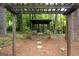 Charming wooden gazebo nestled among mature trees, offering a serene and private outdoor retreat at 2179 Mountclaire Ct, Stone Mountain, GA 30087