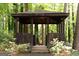 Close-up of the cozy wooden gazebo, featuring a rustic design and offering a peaceful spot to unwind outdoors at 2179 Mountclaire Ct, Stone Mountain, GA 30087