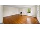 Bright living room with hardwood floors, a fireplace, and large windows at 2179 Mountclaire Ct, Stone Mountain, GA 30087