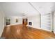 Spacious living area featuring hardwood floors, a fireplace, and built-in shelving at 2179 Mountclaire Ct, Stone Mountain, GA 30087
