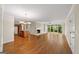 Open living area with hardwood flooring, fireplace, and views of the backyard at 2179 Mountclaire Ct, Stone Mountain, GA 30087