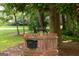 Close-up of a brick mailbox topped with a decorative dog statue, adding unique charm to the home's entrance at 2179 Mountclaire Ct, Stone Mountain, GA 30087