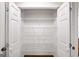 Walk-in pantry with white wire shelving and double doors at 2179 Mountclaire Ct, Stone Mountain, GA 30087
