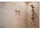 Walk-in shower features beautiful tile work, a built-in niche, and modern shower fixtures at 2179 Mountclaire Ct, Stone Mountain, GA 30087