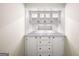 Built-in storage with drawers, cabinets, a countertop, and a mirror backsplash at 2179 Mountclaire Ct, Stone Mountain, GA 30087