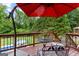 Wooden deck featuring an outdoor seating area with backyard and pool views at 345 Wynbrook Dr, Mcdonough, GA 30253