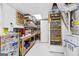 Finished room in basement with built-in shelving, and utility area at 345 Wynbrook Dr, Mcdonough, GA 30253