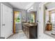 Bathroom with a double sink vanity, granite countertops, and a full-length mirror at 345 Wynbrook Dr, Mcdonough, GA 30253