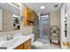 Cozy bathroom with a tiled walk-in shower, vanity, and medicine cabinet at 345 Wynbrook Dr, Mcdonough, GA 30253