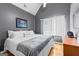 Bright bedroom with large window, wood floors, and neutral paint at 345 Wynbrook Dr, Mcdonough, GA 30253
