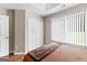 Bright bedroom featuring a tray ceiling, hardwood floors, and double door closet at 345 Wynbrook Dr, Mcdonough, GA 30253