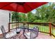 Relaxing deck area with outdoor seating and a view of the backyard pool at 345 Wynbrook Dr, Mcdonough, GA 30253