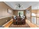 Dining room featuring wood table, bench seating, and decorative ceiling at 345 Wynbrook Dr, Mcdonough, GA 30253