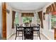 Charming dining area with natural light and backyard view at 345 Wynbrook Dr, Mcdonough, GA 30253