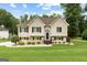 Charming two-story home featuring manicured lawn and inviting front entrance at 345 Wynbrook Dr, Mcdonough, GA 30253